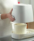 Person installing Humidifier Filter C Replacement Wick With Prefilter Layer into Honeywell humidifier for cleaner air
