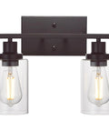 Two Light Industrial Wall Mount Sconces In Oil Rubbed Bronze With Clear Glass Shades; dimmable, mounted on wall.
