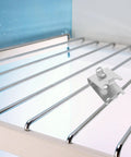4 Pack Stainless Steel Refrigerator Shelf Clips With Adjustable Support Hooks on a metal fridge shelf