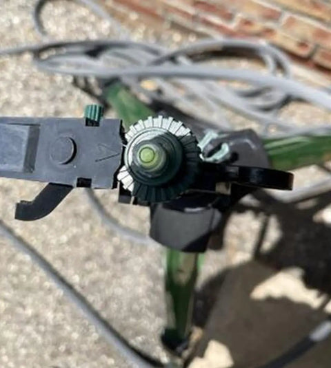 Close-up view of a Job Site Ready 10 Pack Mini Circular Bubble Level's spirit gauge with green bullseye indicator for alignment.