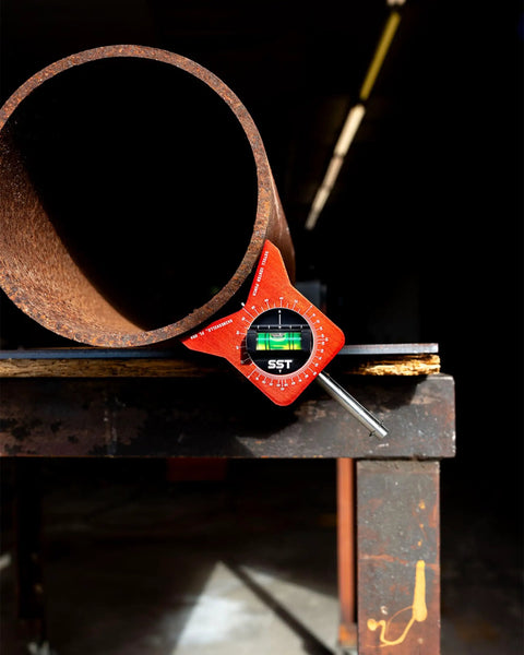 Magnetic Pipe Center Punch Marker with Dual Bubble Levels on pipe for 0 to 10 inch diameter, illustrating pro-grade precision.