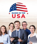 Group of smiling professionals standing together with a sign that says 'Based in the USA' on a wooden background.