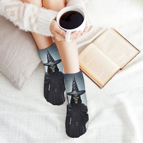 Death Scythe Themed Ankle And Crew Socks 5 Pack with design, worn by person holding coffee on a cozy couch with a book.