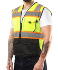 Person wearing Medium High Visibility Safety Vest With Front Pockets Yellow Black Class 2 ANSI ISEA Approved Reflective Tape.