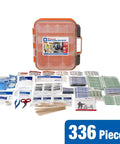 Front view of orange plastic 336-piece first aid kit with clear lid and slide latches, contents shown.