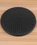 Rock Solid Heavy Duty Rotating Turntable Stand Swivels 360 Degrees Smooth As Butter Manual Display Base For Tv Monitor Takes Up To Fifty Five Pounds Black Non Slip Rubber Pad Ten Inch top view of non-slip rubber pad with diamond pattern base.