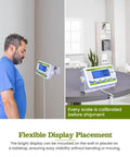 Man using Beefy 440 Lb Capacity Extra Wide Medical Scale With Bariatric Use, Heavy Duty Digital Display, mounted on wall.