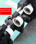 Close-up of metal bearings and durable POM surface on No Sweat Manual Airplane Box Folding Jig for smooth operation.