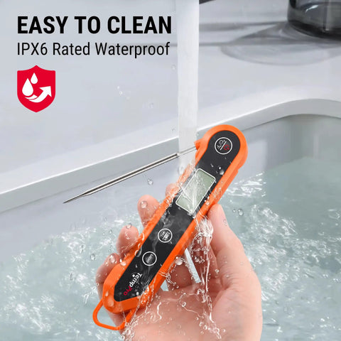 Waterproof Digital Instant Read Meat Thermometer being washed under running water, featuring a 3.9 inch stainless steel probe and backlight.