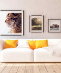 10 Pack Heavy Duty Stainless Steel U Brackets Wall Mount Tile Hangers Rack For Dead Simple Setup Rock Solid Mirror And Picture Frame Grip Sand Grey Home Decor Hooks With Screws used to hang framed artwork above a white sofa with orange pillows.