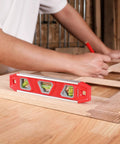WORKPRO 9-inch torpedo level with three bubble vials, red plastic body for woodworking.