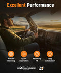 Driver inside vehicle demonstrating precise steering and quiet operation features of hydraulic power steering rack, sunset background