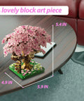 Totally Pink Cherry Blossom Tree Building Set 1113 Pieces For Adults And Kids Sakura Tree House Mini Blocks Kit With Bedroom Lounge And Climbing Stairs STEM Fun Gift Idea For Girls Aged 8 10 12 14 Plus, pink micro block treehouse on table, 5.9 x 4.9 x 5.4 in