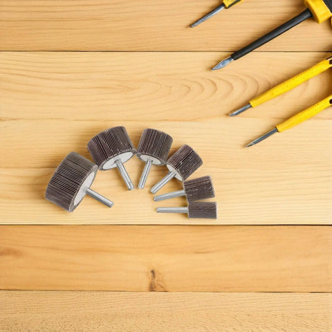 Ditch The Rough Edges With These 12 Assorted Flap Wheel Buffing Sets For Grinding Heads, showing various sizes on wooden surface.