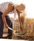 Person using Multi Purpose Manganese Steel Garden Tool With Wooden Handle For Grass Cutting, Weeding, And Harvesting, Durable And Comfy