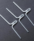 Three alloy clips from 60 Pack Must Have Lawn Chair Webbing Straps Clips Kit For Patio Chairs And Sofa Frames on black surface