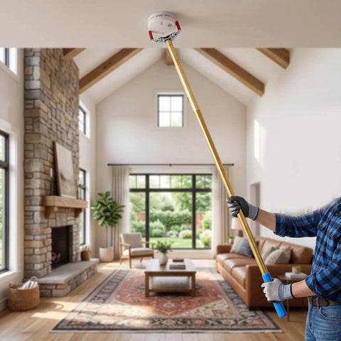 Long Reach Smoke Detector Removal Tool For High Ceilings And Two Story Homes being used to access a smoke alarm.