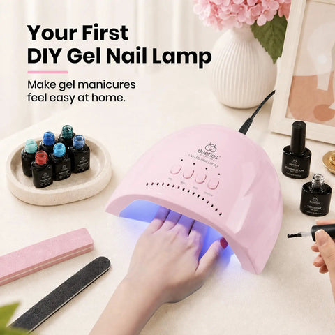 Pink Smart Sensor Gel Nail Lamp For Fast Even Curing Featuring Thirty High Power Led Lights And Triple Timer Settings, curing a hand.