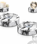 Solid Marble Led Usb Powered Rotating Display Stand With Butter Smooth 360 Spin And Eight Bright Light Modes showcasing a candle and glass sphere.