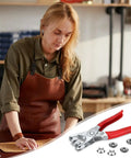 Woman using 200 Piece Metal Snap Button Set with Quick Fastener Pliers Tool Kit for DIY fashion, sewing, durable 9.5mm snaps