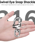 Swivel Eye Snap Shackle shown in hand, 90mm length, 316 stainless steel, designed for marine hardware.