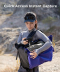 Photographer using Ultralight Camera Backpack For Photographers Expandable To 40L Space Black Suspended Back Panel outdoors.