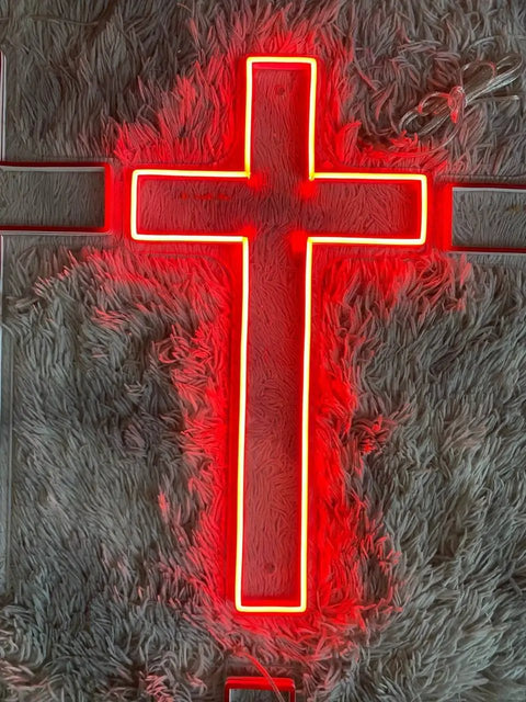 Lit Red LED Neon Cross Sign 10x20 Inch Lighted Jesus Cross Wall Art For Christmas Decor Jesus Night Light Custom Logo Neon Sign Party Sign And Wedding Decor Graduation Gift Ready glowing against a textured background.