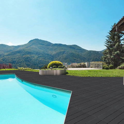 Interlocking Plastic Deck Tiles 12x12 Inches Pack of 20 All Weather Outdoor Indoor Waterproof Pavers by a Pool in Charcoal Gray