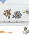Dope 150Pcs Mini Buckle Set Alloy Tiny Buckles For DIY Doll Clothes Sewing Crafts in silver, black, bronze colors shown on table.