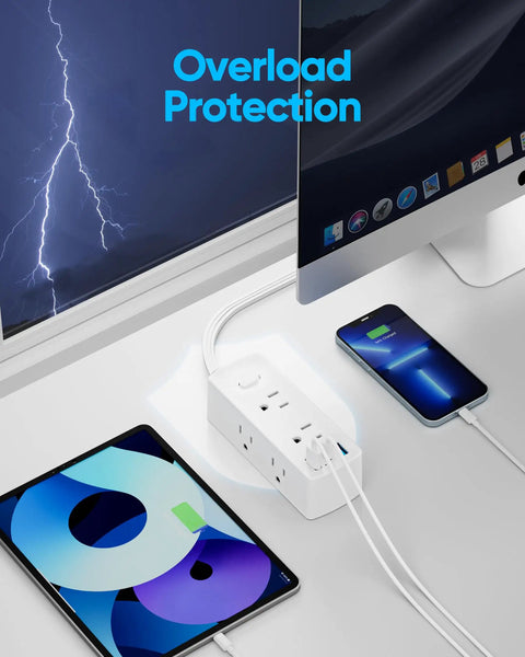 Flat Plug Power Strip With Five Foot Extension Cord Giving Six Wide Spaced AC Outlets Plus Three USB Charging Ports Including One Fast Type C, charging devices on a desk.