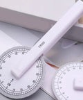 360 Degree Rotating Quilting Ruler With Scaled Roller Wheel For Precise Pattern Making And Angle Measurement on a gray background.