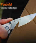 Your Go To Everyday Carry Folding Pocket Knife With 3.39 Inch 14C28N Blade cutting cardboard