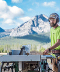 Cordless 36V Table Saw With Brushless Motor, 10 Inch Blade, used by a man outdoors with mountains in the background