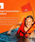 Child in water wearing Bright Orange Life Jacket Safety Flag With Adjustable Pouch And Universal Straps, smiling