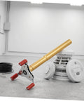 Heavy Duty Ceiling Detector Removal Tool With Badass Rubberized Claw And Extendable Aluminum Shaft next to a fire sensor.