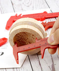 Depth Vernier Caliper Micrometer Gauge Measuring Tool measuring diameter of wooden piece, red plastic, user-friendly design.