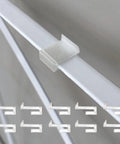 Patio Table Glass Clip Rim Spacer Replacement Kit For Outdoor Furniture Weatherproof TPU Cushions Stop Glass Rattle And Slide Tool Free Slip In Design Style B showcasing multiple semi-clear clips on a metal table edge, highlighted in close-up view.