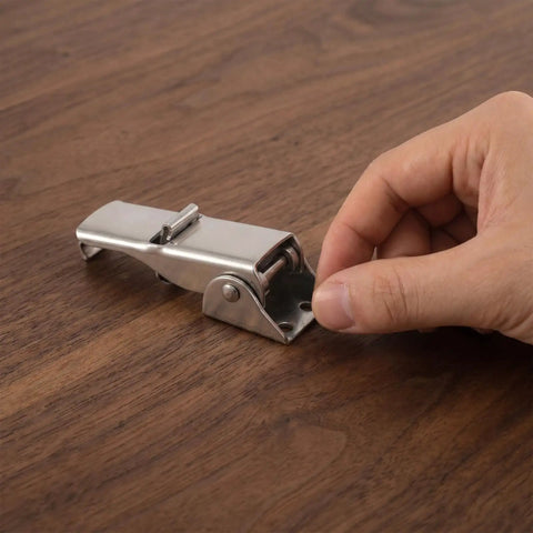 Heavy Duty Adjustable Toggle Latch Stainless Steel 304 Secures Industrial Toolbox Storage Box Vibration Proof Draw Hardware Clasp Fastener For Heavy Use on a wooden surface being adjusted.