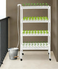 4 Tier Indoor And Outdoor Hydroponic Grow Rack With 12 Pipes And 108 Plant Sites on balcony, featuring foot pads and casters