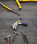 Heavy Duty Pro Grade Sheet Metal Bender Hand Seamer Pliers With Non Slip Textured Handle among metalworking tools on wooden surface