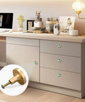 Four Piece Round Drawer Knobs And Cabinet Hardware Featuring Green And Gold Swirl Marbled Finish With Included Mounting Screws for kitchen cupboards.