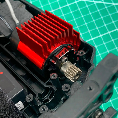 Close-up of Aluminum Adjustable RC Motor Mount 4 Piece Set for 1/18-1/14 Trucks installed, showing red aluminum heat sink.