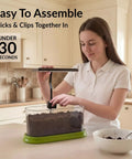 Woman assembling Indoor Garden Starter Kit With LED Grow Light And Root Viewing Window For Beginners in a kitchen