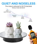 Smooth Moves Motorized Rotating Display Turntable Platform 7.87 Inch Black with two potted plants for quiet showcasing.