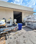 Outdoor view of warehouse with Yamaha equipment boxes and marine gear, highlighting Lightspeed Underwater Light Coating For Marine Illumination.