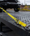 Ratchet Straps With Wire J Hooks, 2In x 15Ft, Four Pack, Classic Yellow Webbing securing a vehicle on flatbed
