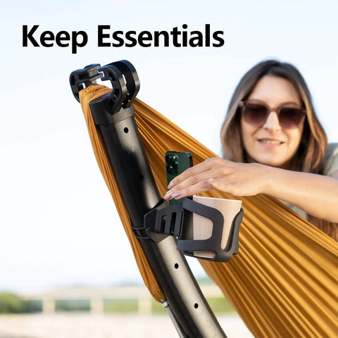 Close-up of Setup in 3 Seconds Adjustable Portable Aluminum Hammock Stand showing accessory holder with a person using it outdoors.