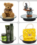 Smooth Moves Motorized Rotating Display Turntable Platform 7.87 Inch Black showcasing teddy bear, beauty products, handbags, and decorative items.