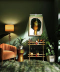 Living room with dimmable picture light illuminating artwork above bar cart, showcasing modern decor and plants