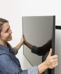 Person installing a 55 inch TV using No Stud TV Wall Mount For 26 To 55 Inch Flat Screens With Built In Level Quick 10 Minute Install